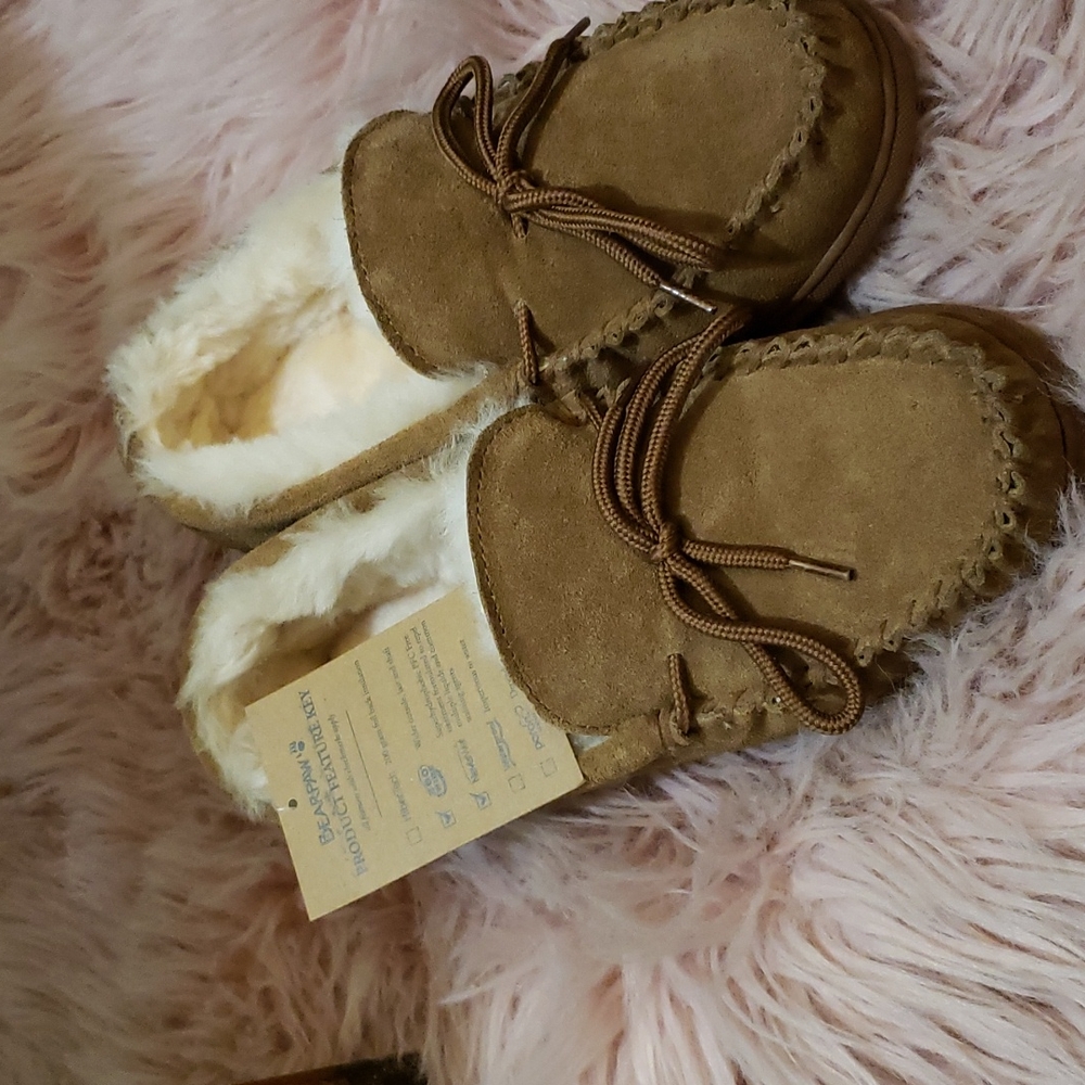 A pair of brand new Bearpaw slippers.